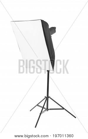 A modern gray softbox isolated over the white background. Professional lighting equipment for photo studios. A big stripbox with a flashlight on a tall tripod. Photographic accessory.
