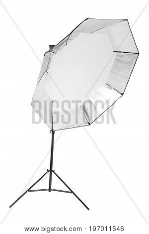 A professional studio octobox isolated over the white background. A dark saturated black octobox on a long metal tripod. Photographic equipment for photographers. Photo business.