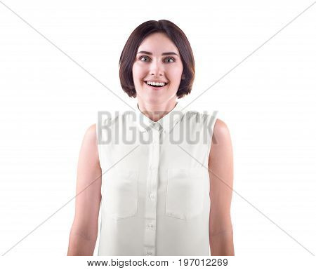 A happily laughing young woman isolated over the white background. A crazy and surprised office lady in a casual white blouse. A funny brunette girl with a stylish black haircut.