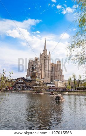 Moscow Russia- May 012017: View of the Kudrinskaya Square Building seen from the zoo during the midday on May 012017. The Kudrinskaya Square Building is one of seven Stalinist skyscrapers.