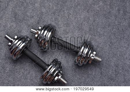 dumbbell pace on floor in gym room.
