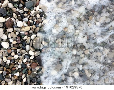 Coastal sea pebbles, different shapes and shades