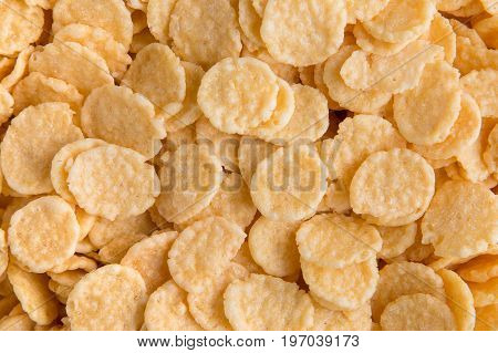 Cornflakes background. Crispy corn flakes for breakfast.
