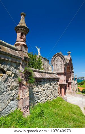 Sculpture of a Guardian angel with a sword in the cemetery of Comillas. Cantabria Spain