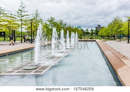 Montreal, Canada - May 26, 2017: Parc Des Faubourgs With Fountains And People In City In Quebec Regi
