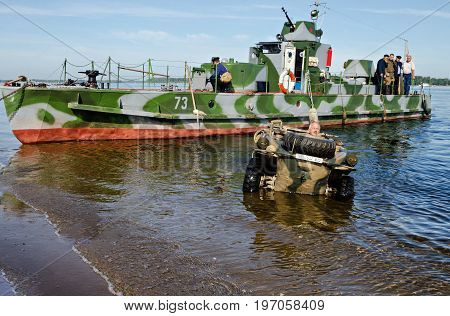 Historical festival of the Second World war to Samara, July 26, 2015. The Soviet landing craft and German floating car on the Volga river, before reconstruction.