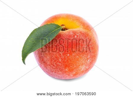 A delicious orange peach close-up.  Juicy and healthy peach with green leaf, isolated on the white background. A colourful and fresh ripe fruit for healthy summer snack.