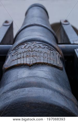 Focused on inscription on ancient cannon close up. Shallow depth of field. Munkacs var.