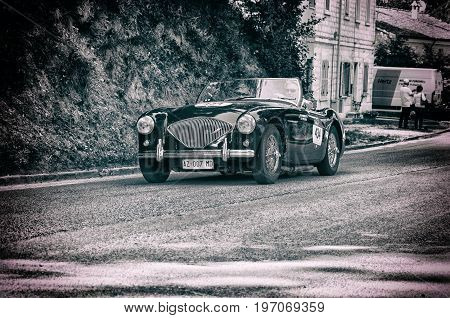 GOLA DEL FURLO, ITALY - MAY 19: AUSTIN HEALEY 100/4 1956 on an old racing car in rally Mille Miglia 2017 the famous italian historical race (1927-1957) on May 19 2017