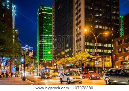 Montreal, Canada - May 27, 2017: Downtown Area With Traffic Cars And Complexe Desjardins Green Build