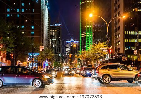 Montreal, Canada - May 27, 2017: Downtown Area With Traffic Cars And Complexe Desjardins Green Build