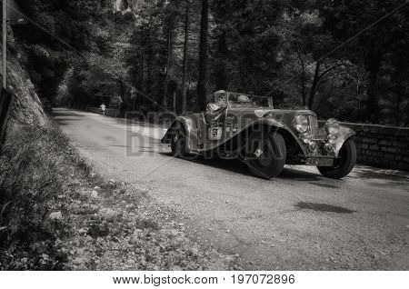 GOLA DEL FURLO, ITALY - MAY 19: ASTON MARTIN 15/98 SHORT CHASSIS 1937 on an old racing car in rally Mille Miglia 2017 the famous italian historical race (1927-1957) on May 19 2017