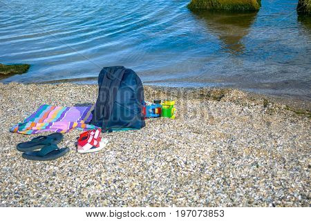 Things for the beach towel sunscreen flip flops