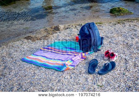 Things for the beach towel sunscreen flip flops
