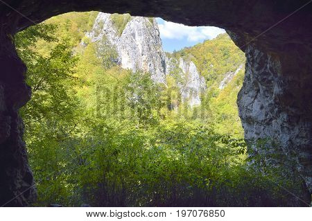 Landscape seen from a cave Transylvania. Concept ecology protection. Explore the world's beauty