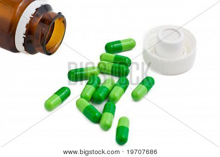 Closeup visning af medicin breder fra flaske