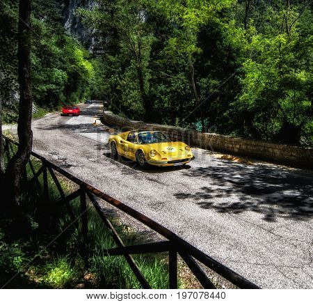 GOLA DEL FURLO, ITALY - MAY 19: FERRARI 246 DINO GTS 1973 on an old racing car in rally Mille Miglia 2017 the famous italian historical race (1927-1957) on May 19 2017