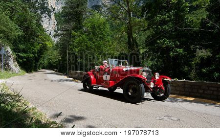 GOLA DEL FURLO, ITALY - MAY 19: O.M. 665 SUPERBA 1927 on an old racing car in rally Mille Miglia 2017 the famous italian historical race (1927-1957) on May 19 2017