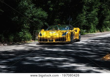 GOLA DEL FURLO, ITALY - MAY 19: FERRARI 488 SPIDER on an old racing car in rally Mille Miglia 2017 the famous italian historical race (1927-1957) on May 19 2017