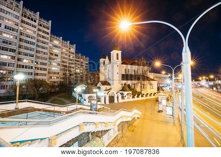 Minsk, Belarus - April 3, 2017: Evening Night View Of Cathedral of the Holy Apostles Sts Peter and Paul On Illuminated Nemiga Street. Temple of the Belarusian Exarchate of the Russian Orthodox Church