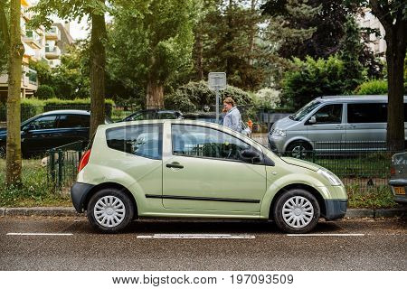 STRASBOURG FRANCE - MAY 30 2017: Small cute green Citroen C2 car parked on the French street
