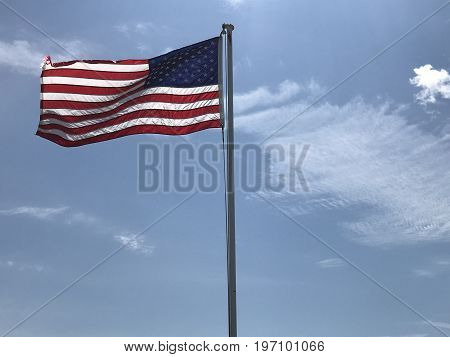 Old Glory still waving proudly as the clouds roll by
