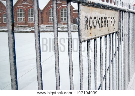 Snow at the rookery road with fence in Birmingham