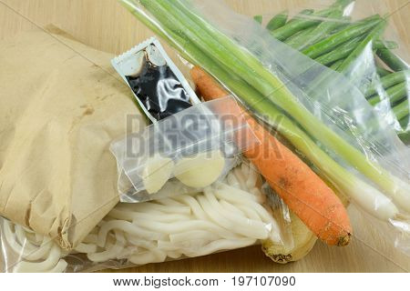 Packaged food items in meal delivery kit