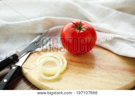 Tomato on brown wooden backgroound. Lifestyle healthy eating Food photo concept