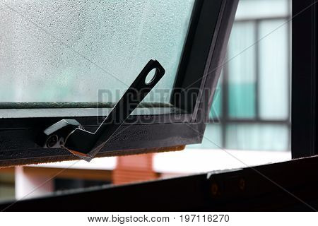Open window with water drop on the glass - soft focus