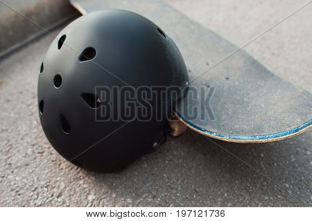 Skateboard halmet and safety acessrise. Head care protection from injoury. Extreme sport background. Headwear stuff for skater