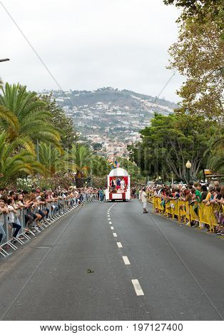 FUNCHAL MADEIRA PORTUGAL - SEPTEMBER 4 2016: Men in historical fashion dress raise toasts durnig historical and ethnographic parade of Madeira Wine Festival in Funchal. Madeira Portugal
