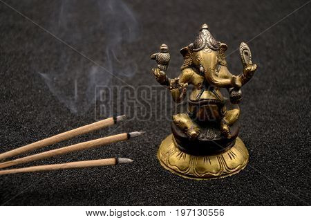 Ganesha on black background close up photo