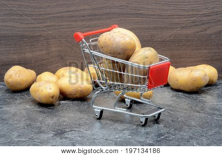 Potatoes on black background close up photo