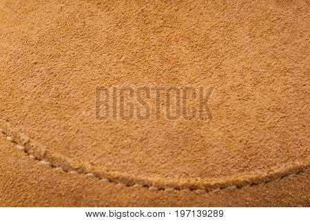 Brown leather background suede texture with stitching