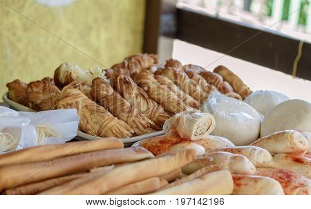 Lying bundles of smoked cheese in Adygea, Russia.