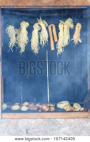 Hanging bundles of smoked cheese in Adygea, Russia.