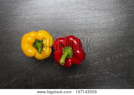 Raw sweet pepper. Sweet Pepper are rich sources of antioxidants and vitamin C.Top view with copy space. Dark background.