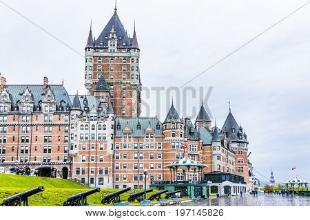 Quebec City, Canada - May 30, 2017: Old Town Street And View Of Hotel Chateau Frontenac With Cannons