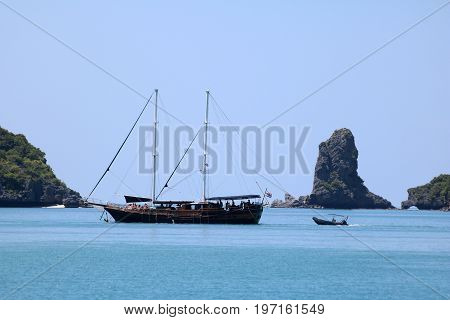 Sailboat sailing between islands gulf of Thailand.