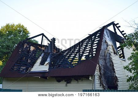 Damage to the roof from the fire. The house completed by Siding suffered from a fire. Fire safety