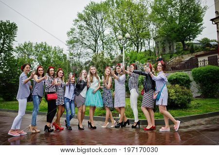 Eleven Attractive Braidsmaids With Lovely Bride Celebrating Bachelorette Party With Champagne In The