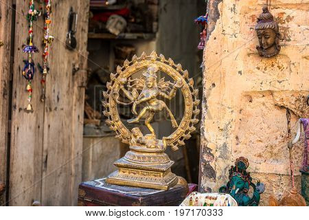 Jaisalmer Rajasthan India miniature bronze statuettes on the market counter