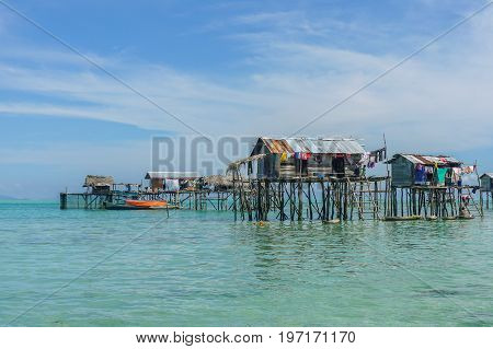 The traditional sea gypsy water village in Bodgaya Island in Tun Sakaran Marine Park,Semporna,Sabah,Borneo,Malaysia.Clear blue water & sandy beach.Beautiful vacation & destination.