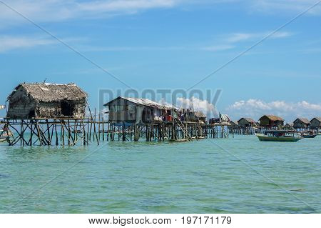 The traditional sea gypsy water village in Bodgaya Island in Tun Sakaran Marine Park,Semporna,Sabah,Borneo,Malaysia.Clear blue water & sandy beach.Beautiful vacation & destination.