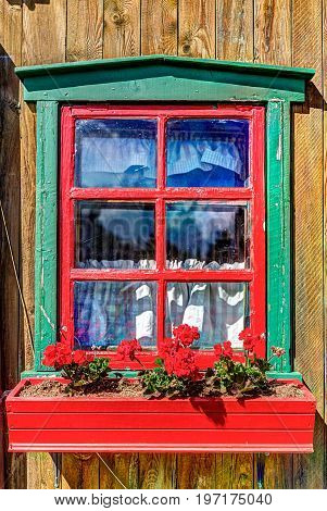 Colorful French Windowsill Painted In Red And Green With Gerainum Pelargonium Flowers