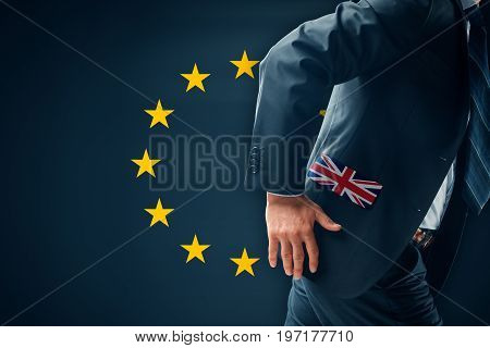 Brexit concept. Businessman (financier, bank employee, CEO, manager) run away (escape) from EU.