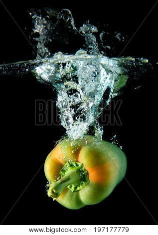 Splash Water From Water Droping Bell Pepper.