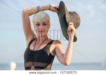 Young pretty slim blonde on a beach