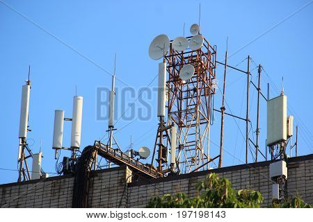 Telecommunication Base Stations Network Repeaters On The Roof Of The Building. The Cellular Communic